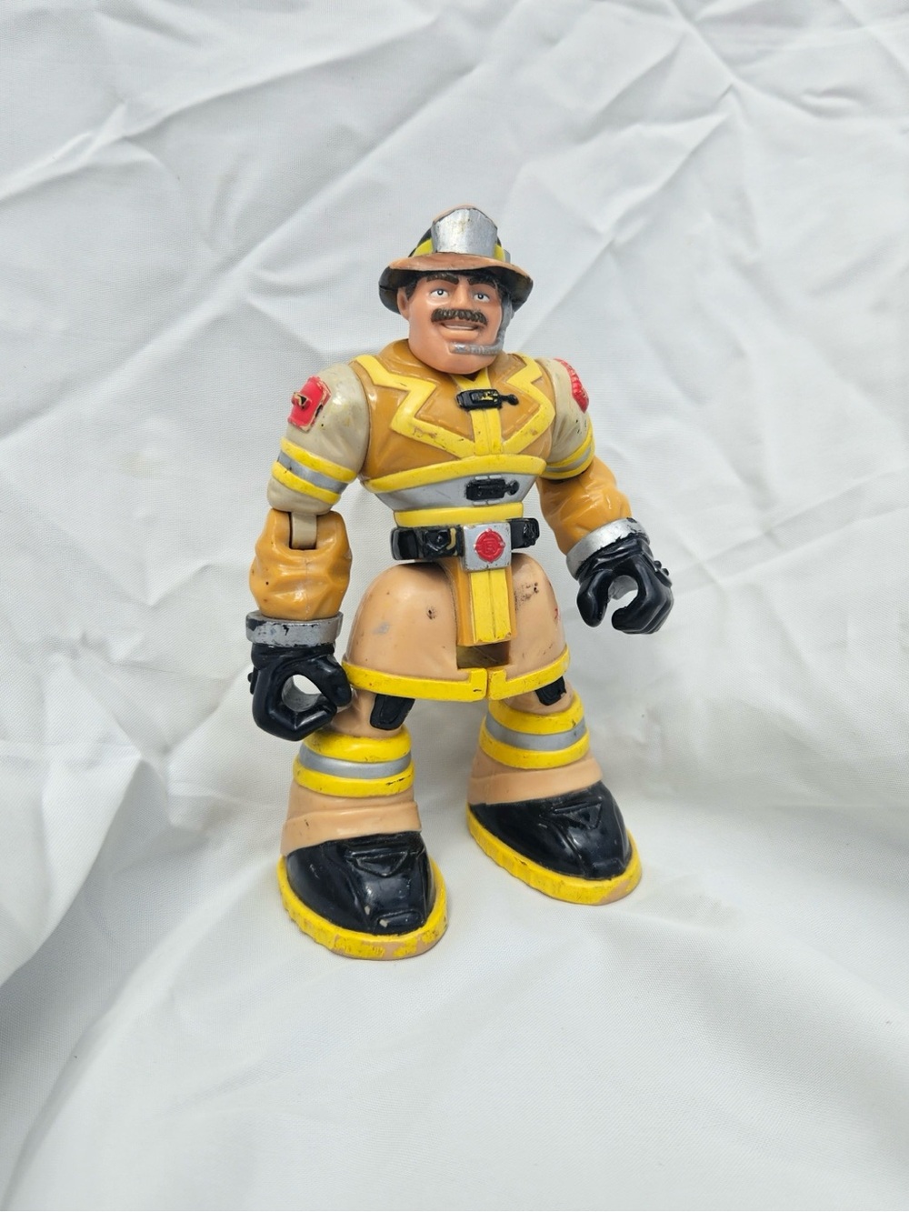 Vintage Fisher-Price Yellow and Black Firefighter Action Figure